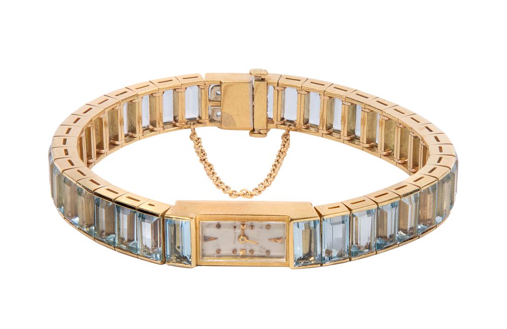 Lot 543: 18k Yellow Gold and Blue Tourmaline Case and Band Wristwatch