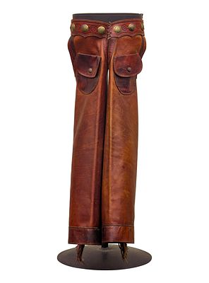 Brown Leather Chaps Each leg having ten silver conchos on the side, marked 'W.R.T.C. Maker' on 