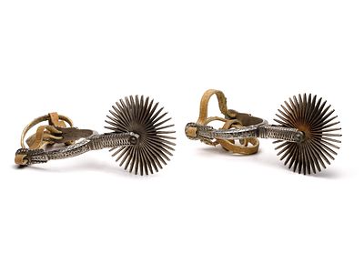 Chilean Huaso Spurs A pair having overall cast and stamped decoration, 4-inch diameter 29-point 
