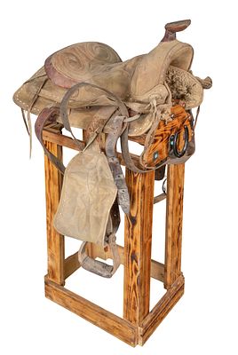 Leather Saddle A working ranch saddle having a quilted seat and cantel as well as leather 