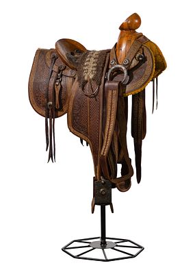 Mexican Silver and Leather Saddle c.1920, hand tooled leather having exposed wood horn and 