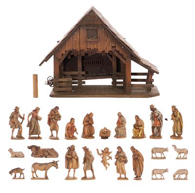 Anri Christmas Nativity Set Carved wood creche set having a lit stable having music box and 