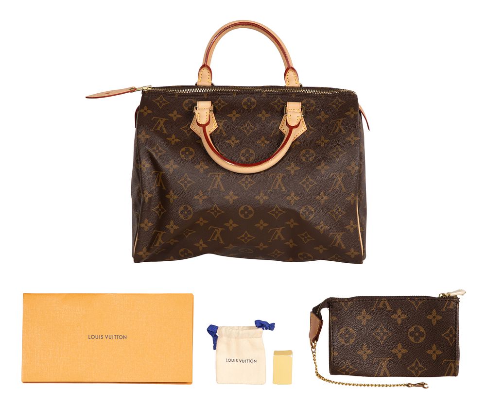 Louis Vuitton - Louis Vuitton Speedy 30 Handbag 
Having coated exterior monogram canvas, interior 