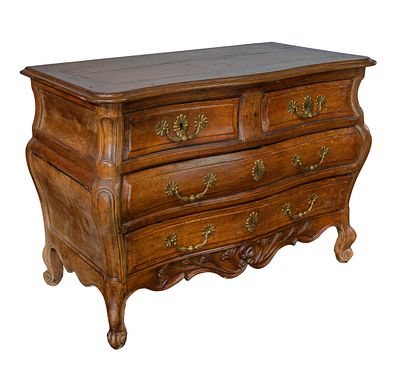 Italian Walnut Bombe Commode Having pegged construction, two dovetailed half drawers over two 