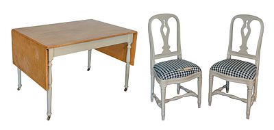 Table and Chairs Including a drop leaf table having a maple wood top and a pair of Ikea of 