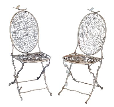 Bird's Nest Metal Folding Chairs A pair of metal garden chairs having a bird, straw and leaf 
