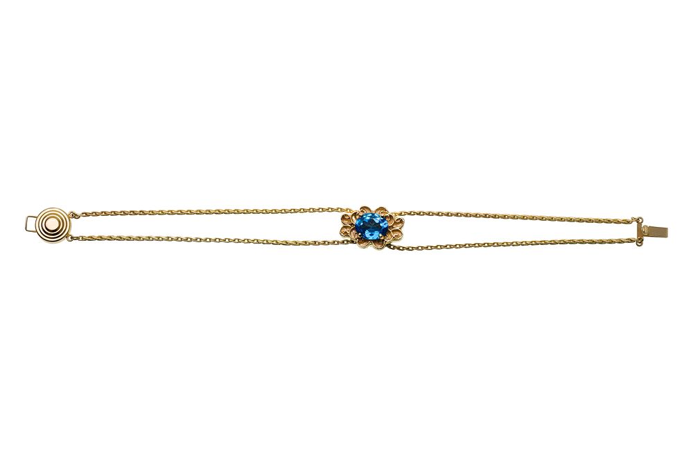 Lot 314: 14k Yellow Gold and Blue Topaz Bracelet