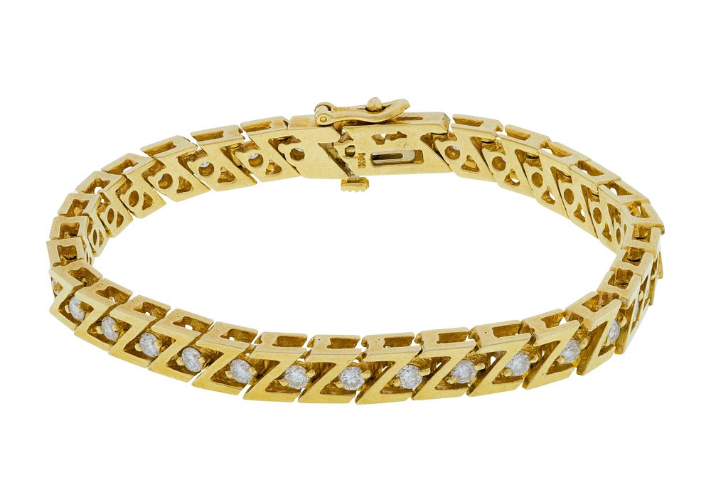 Lot 315: 14k Yellow Gold and Diamond Bracelet