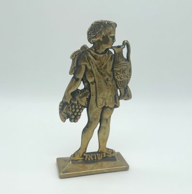 Israeli Child Sculpture - Wine. Sculpture of an Israeli boy holding grapes and a jug of wine. 