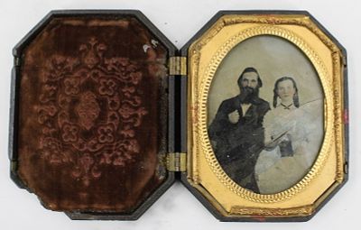 Ambrotype of Happy Couple. Quarter plate ambrotype of a couple with pink tint to cheeks and blue 