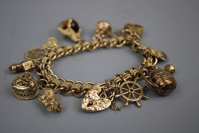 9ct Gold Bracelet &amp; Charms Approx. Gross Weight 61.3g (10% buyer’s premium on this Lot)