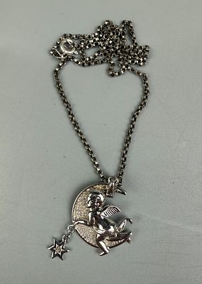 Silver Pendant Of Cupid On Silver Chain