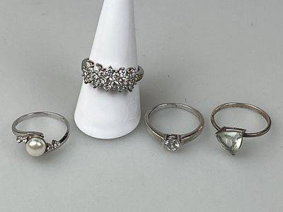 Four Silver Stone Set Rings