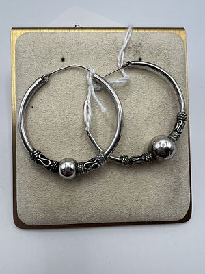 Near Pair of Silver Hoop Earrings