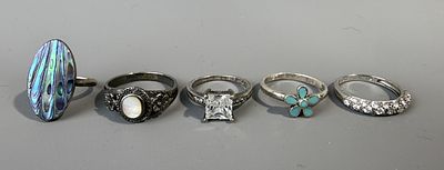 Five Silver Stone Set Rings.