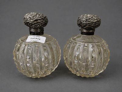 Pair of Victorian Cut Glass Silver Topped Bottles