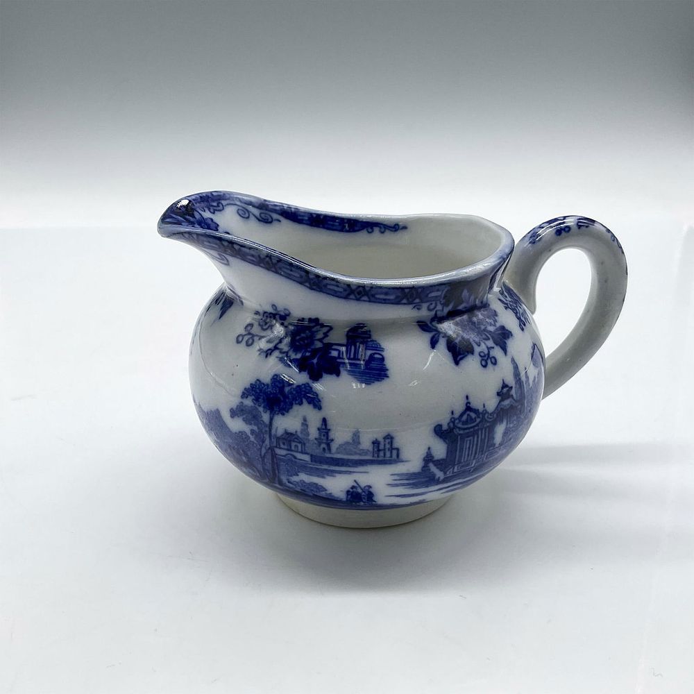 Royal Doulton Madras Flow Blue Porcelain Creamer. Blue cityscape and countryside motifs over 