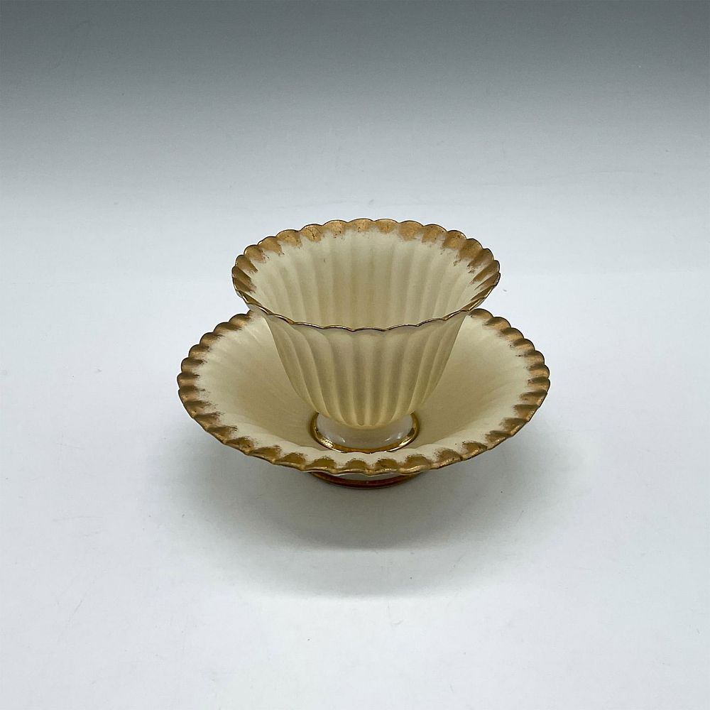 CAC Belleek Eggshell Porcelain Footed Handless Cup and Saucer. Delicate, ribbed design in cream 