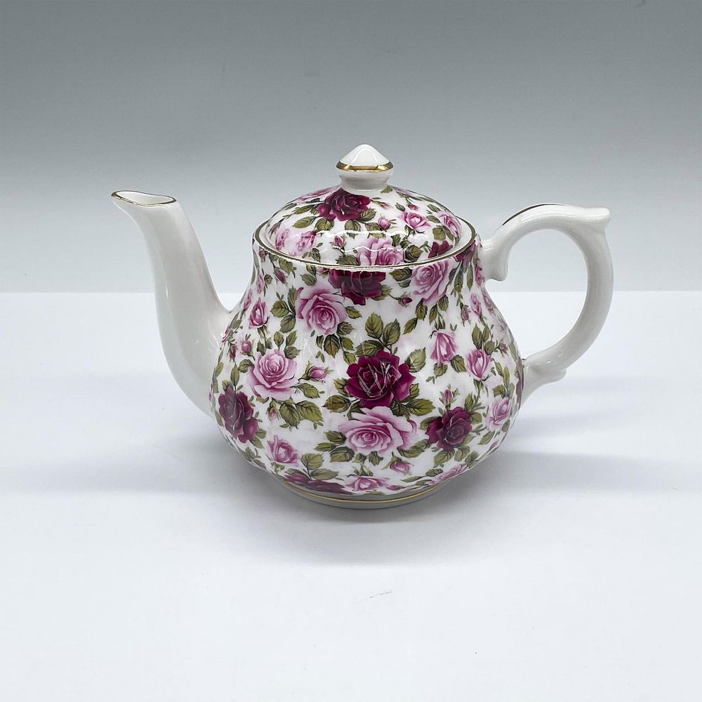 David Michael China Floral Teapot with Lid. English white stout teapot decorated in a pink and 