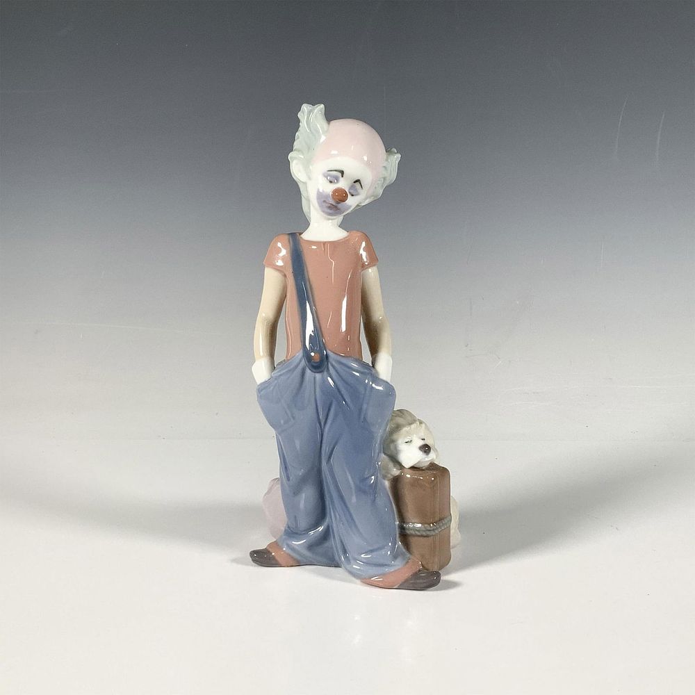Destination Big Top 1006245 - Lladro Porcelain Figurine. A glossy figure of a sad looking clown 