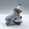 Pierrot w/ Puppy & Ball 1005278 - Lladro Porcelain Figurine. Glossy porcelain figure of a boy Image - 1