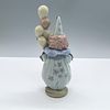 Littlest Clown 1005811 - Lladro Porcelain Figurine. An adorable clown dressed in a blue suit Image - 1