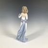 Anticipation 1006608 - Lladro Porcelain Figurine. A glossy figure of a woman in an elegant white Image - 1