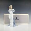 Anticipation 1006608 - Lladro Porcelain Figurine. A glossy figure of a woman in an elegant white Image - 3