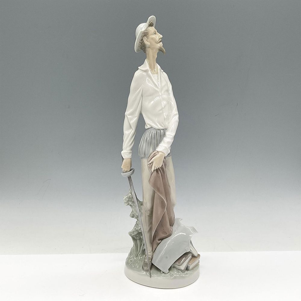 Don Quixote - Lladro Porcelain Figurine. This literary standing hero is holding his sword in 