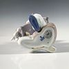 Little Riders 1007623 - Lladro Porcelain Figurine. A glossy figure depicting a young boy holding Image - 2