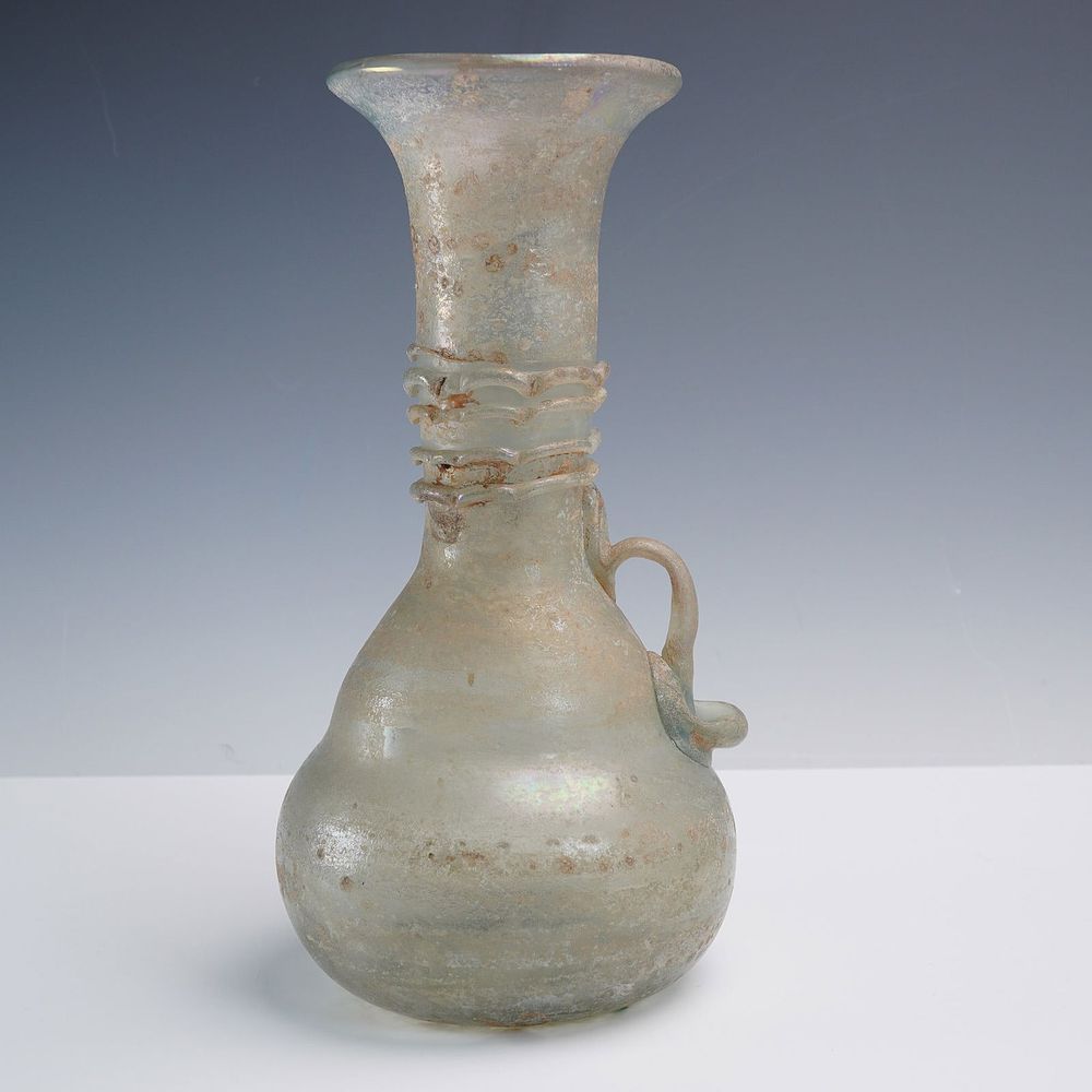 Ancient Glass Vessel with Applied Handle. This ancient-style glass vessel features a delicately 