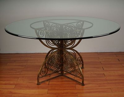 Mediterranean Style Glass Top Dining Table with Gilded Iron Scrollwork Base. Elegant round