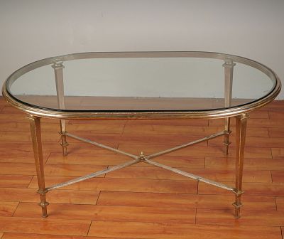 Hollywood Regency Style Oval Glass Cocktail Table w/ Gilt Iron Base. Refined oval cocktail table