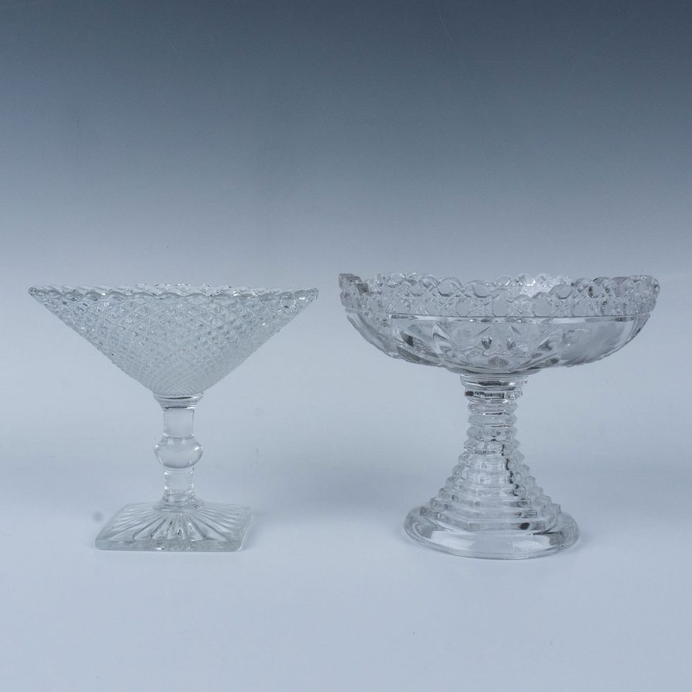 2pc Glass Crystal Pedestal Dishes. Two elegant glass dishes with pedestal bases. The floral one 