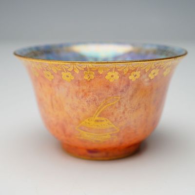Wedgwood Fairyland Lustre Cup, Z4825. The exterior showcases a vivid orange lustre finish with
