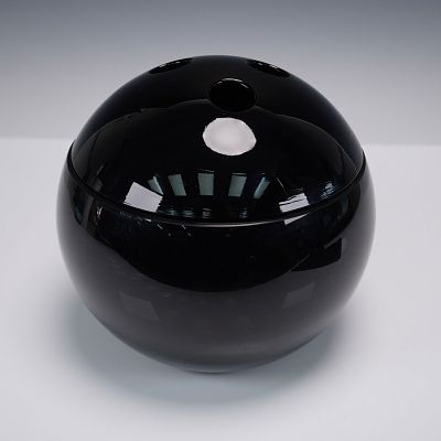 Black Art Glass Covered Bowl With Bowling Ball Lid. Sculptural black art glass vessel with