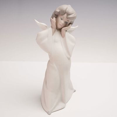 Lladro Porcelain Figurine, Cherub, Puzzled 10114959. A charming Lladro porcelain figurine titled 