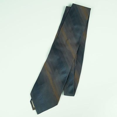 Gucci Striped Silk Necktie. A sophisticated necktie by Gucci, made in Italy from 100% silk. 
