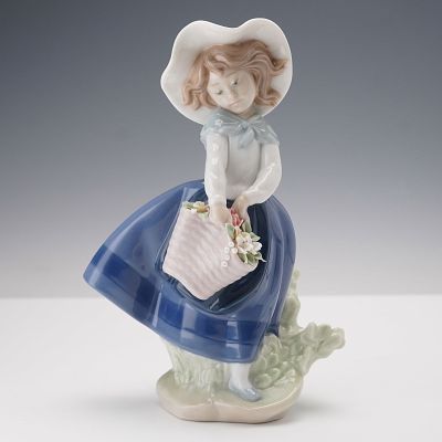 Lladro Porcelain Figurine Pretty Pickings 01005222. A young girl with a basket of flowers is 