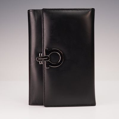 Salvatore Ferragamo Black Leather Wallet with Black Logo Closure. This Salvatore Ferragamo 