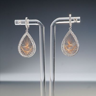 Pair of 14K Two-Tone Gold 1.10ctw Diamond Teardrop Dangle Earrings. A striking pair of 14K 