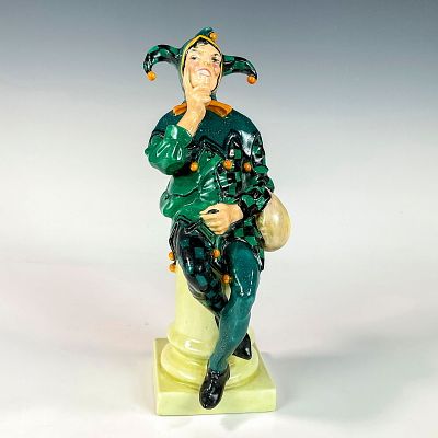 Royal Doulton Figurine, Jester HN71. Glazed porcelain, modeled as a jester sitting with crossed 
