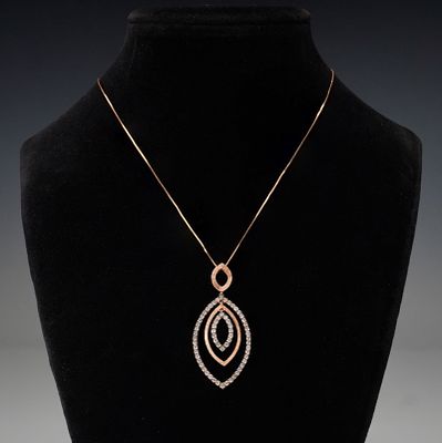 14K Rose Gold 1.02ctw Champagne Diamond Pendant Necklace. A striking 14K rose gold necklace 