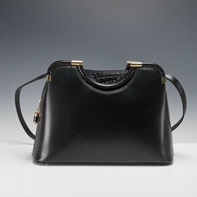 Judith Leiber Handbag, Black Leather with Crocodile Trim. This exquisite Judith Leiber handbag 