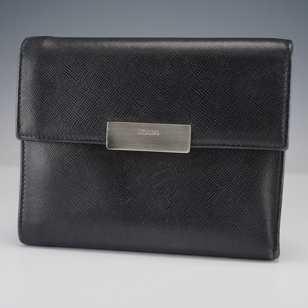 Prada Black Leather Wallet with Card Slots and Coin Pocket. This Prada wallet is made from 