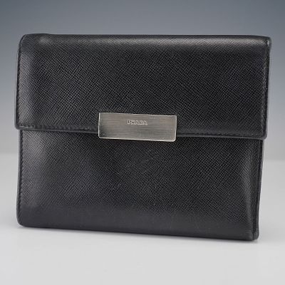 Prada Black Leather Wallet with Card Slots and Coin Pocket. This Prada wallet is made from 