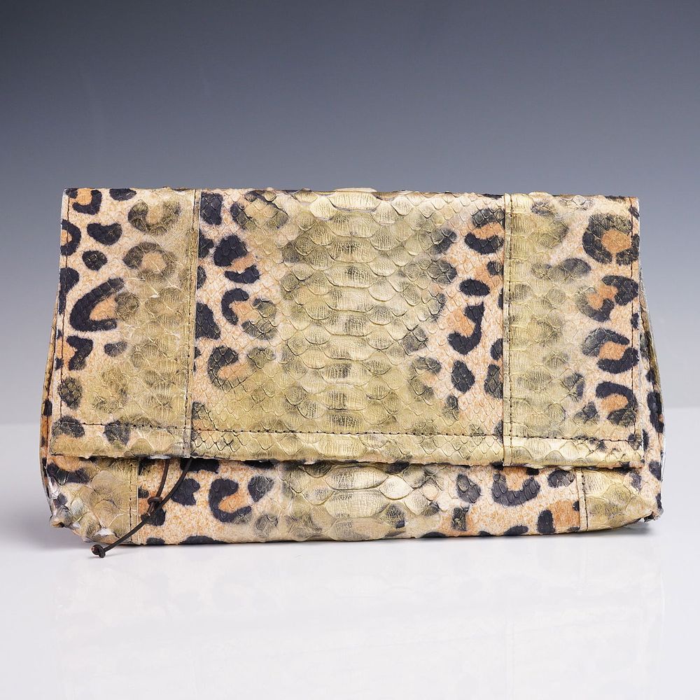 B. May Foldover Python Clutch Purse. A striking foldover clutch by b. may, crafted from genuine 