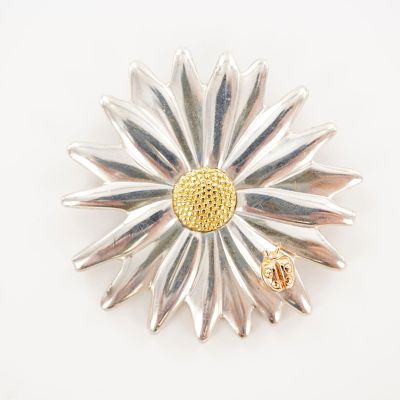 Tiffany & Co. Sterling Silver and 18K Gold Daisy with Ladybug Brooch. Designed as a dimensional 