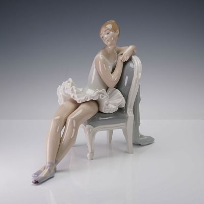 Lladro Porcelain Figurine, Classic Dance 01004847. Ballerina momentarily at rest as she leans 