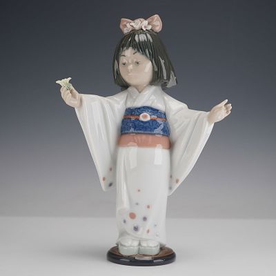 Lladro Porcelain Figurine, Flower Gazer 1006152. Glazed porcelain Lladro figure model 6152 